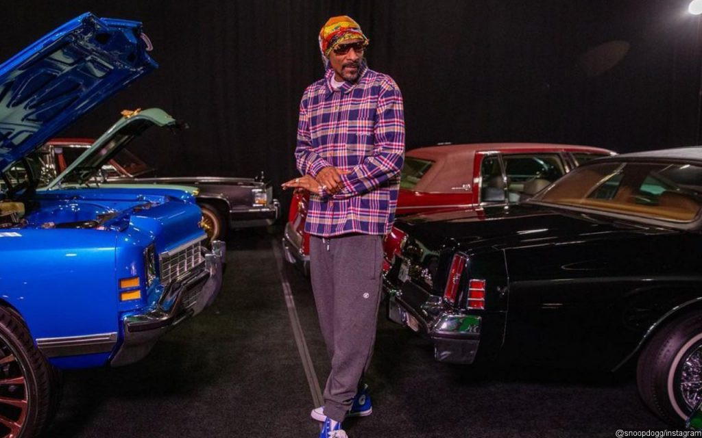 Snoop Dogg's luxury car collection, including Cadillacs and Rolls Royce.