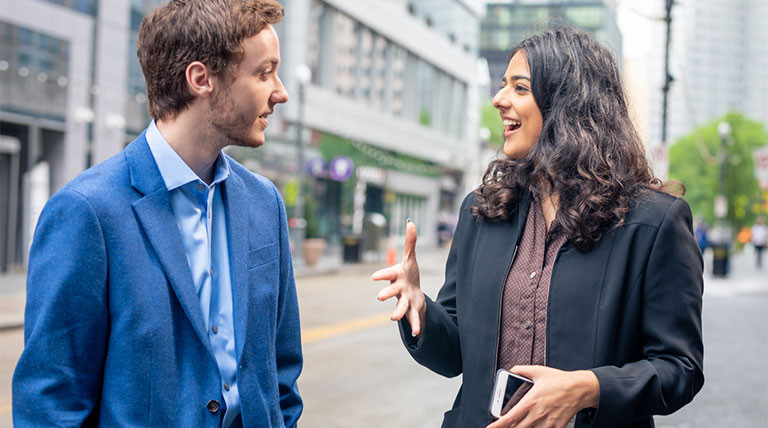 Young professionals in downtown Pittsburgh showcasing the city's urban environment