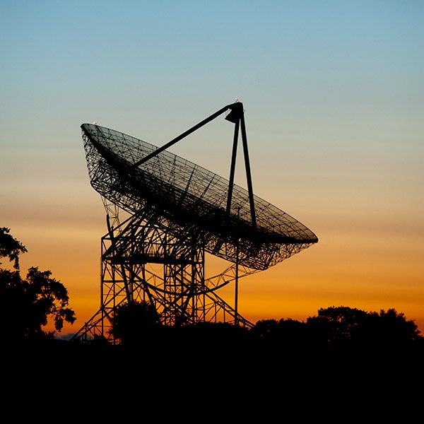 The Dish at Stanford University surrounded by green hills and hiking trails.