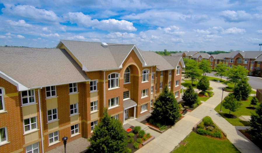 Scenic view of South Lake Village Apartments complex by Lake LaSalle.