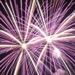 Sparklers being held during a fireworks display