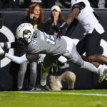 Cincinnati Bearcats football game against Colorado Buffaloes, with a focus on Scott Springer's game analysis.