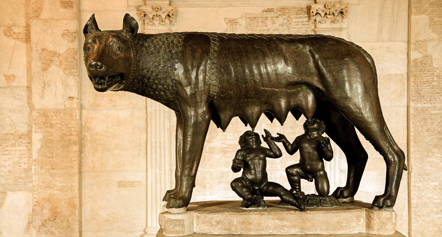Bronze statue depicting the Capitoline Wolf suckling Romulus and Remus, symbolizing the legendary founders of Rome.