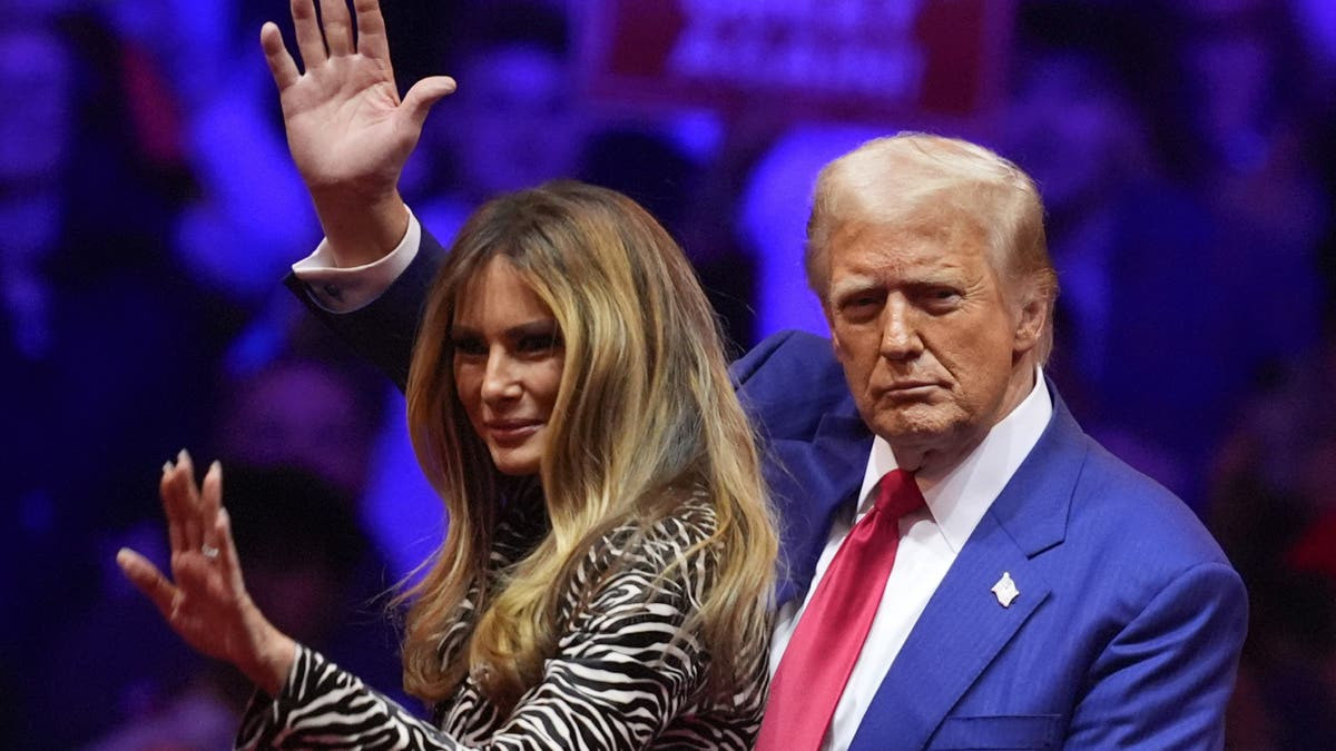 Donald and Melania Trump waving to crowd at Madison Square Garden