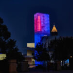 The World of Coca-Cola museum in Atlanta, Georgia, the birthplace of Coca-Cola, illuminated at night.
