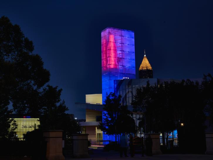 The World of Coca-Cola museum in Atlanta, Georgia, the birthplace of Coca-Cola, illuminated at night.