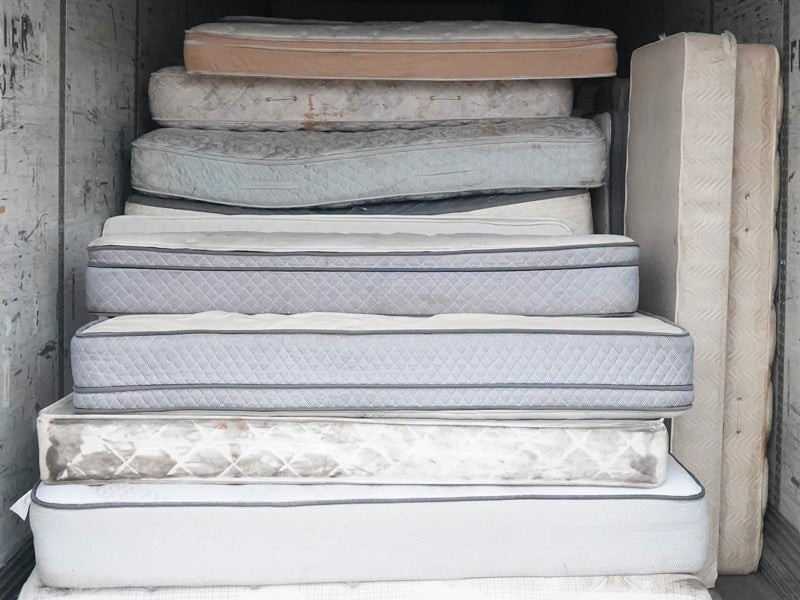 Stack of mattresses ready for recycling