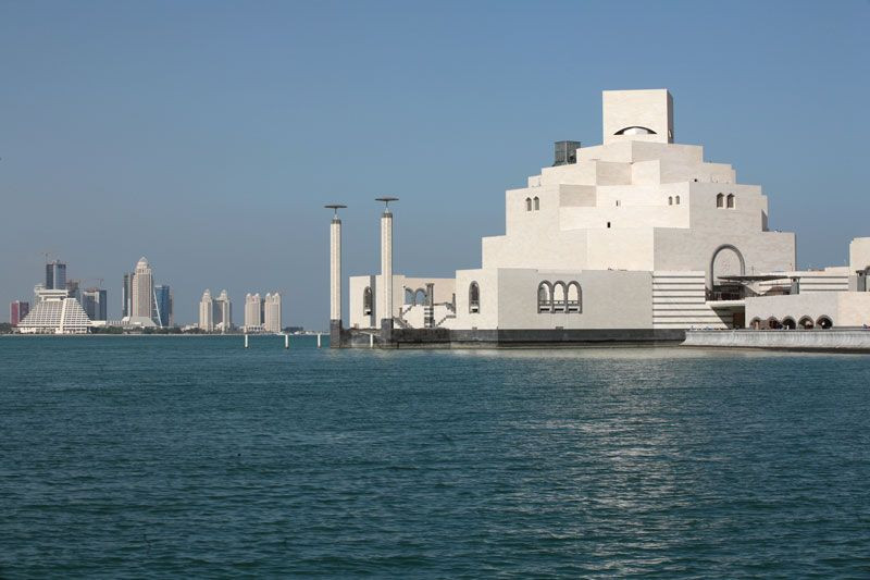 The Museum of Islamic Art in Doha, Qatar, showcasing its unique architectural design by I.M. Pei against the Doha skyline.