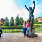 Visitors running up the Rocky Steps at the Philadelphia Museum of Art in Philadelphia, recreating the iconic scene from the movie Rocky