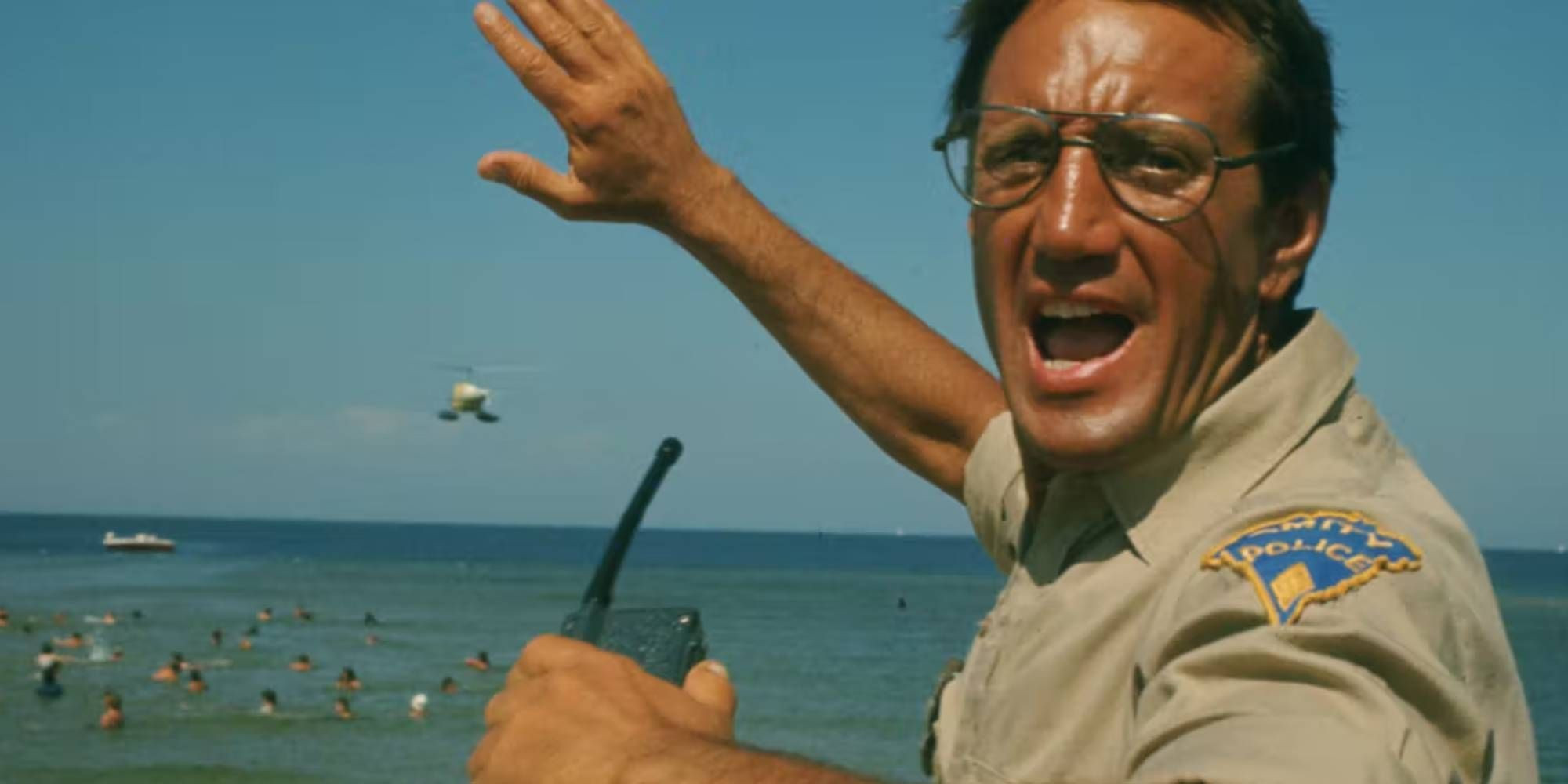 Roy Scheider holding a walkie-talkie in 