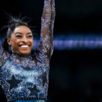Simone Biles, renowned Olympic gymnast, smiles. Discover where this decorated athlete pursued her college education.