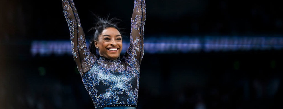Simone Biles, renowned Olympic gymnast, smiles. Discover where this decorated athlete pursued her college education.