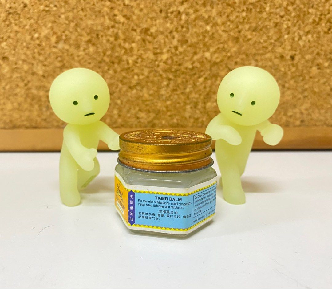 A close-up of Smiski figures still in their blind boxes, emphasizing the packaging details to check for authenticity.