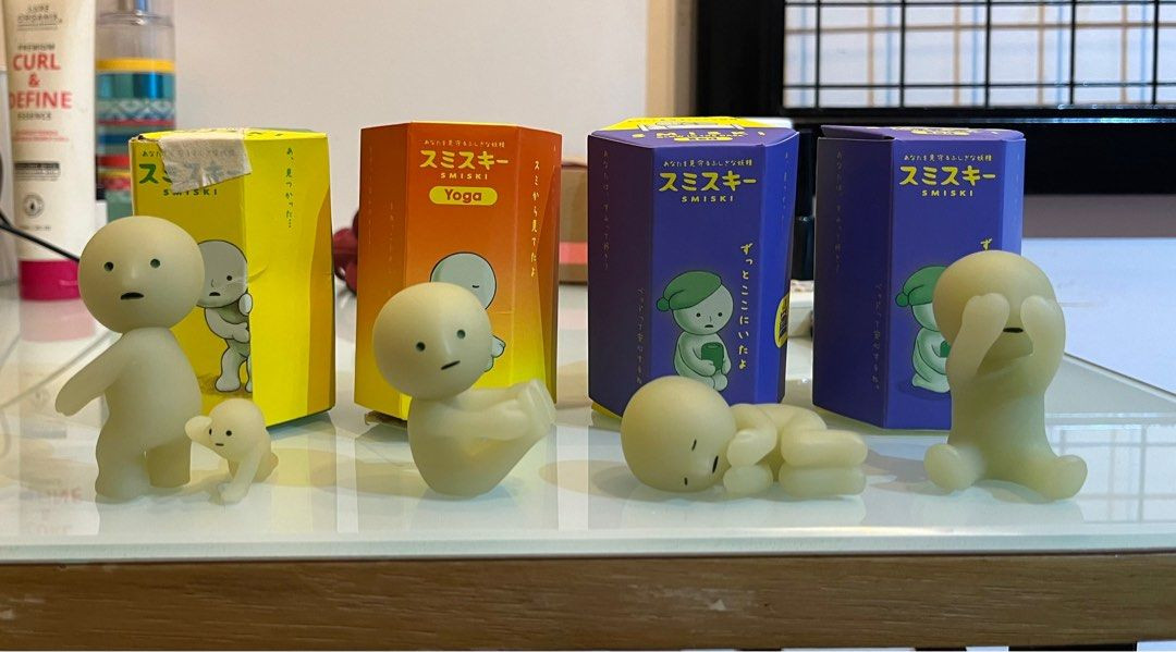 Smiski Bed Series figurines displayed in a bedroom setting, highlighting their placement and ambient glow.