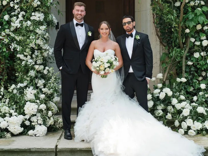 Eminem with his daughter Hailie Jade at her wedding, showcasing his role as a father