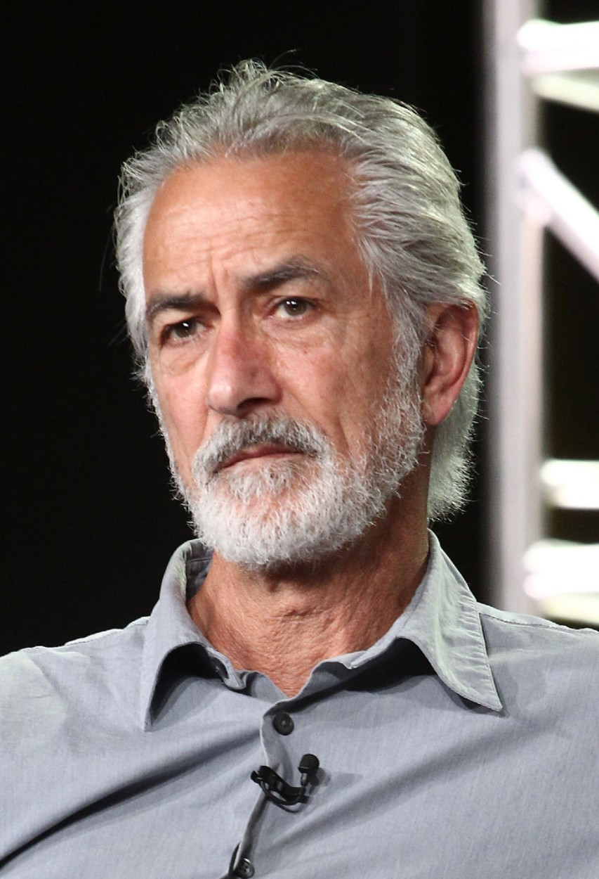 David Strathairn as Tom Milton in Where the Crawdads Sing film, looking with concern and determination.