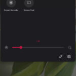 Mobile phone displaying a screen recording icon, illustrating how to download Instagram Reels.