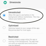 Smartphone user accessing battery settings