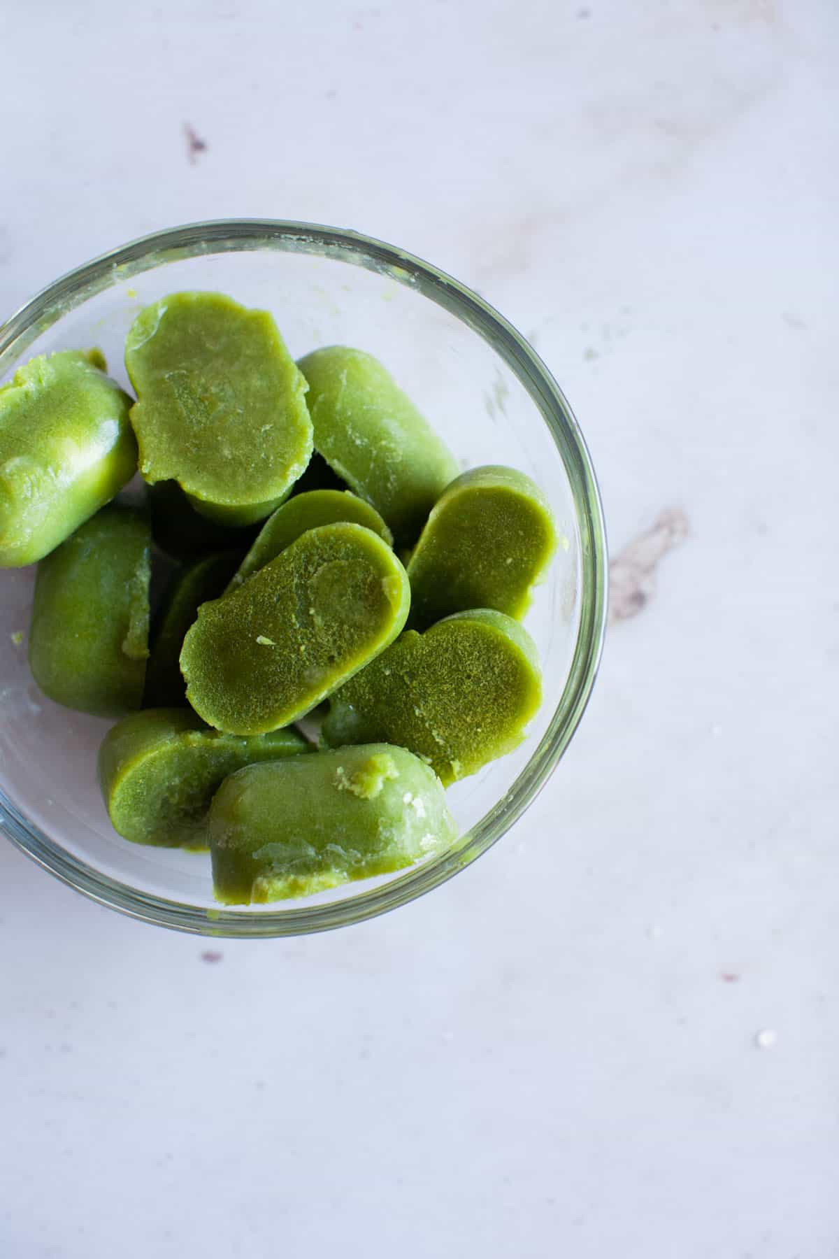 green smoothie that has been frozen into ice cubes