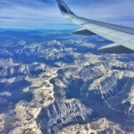 Woman packing a suitcase to save money on Frontier Airlines