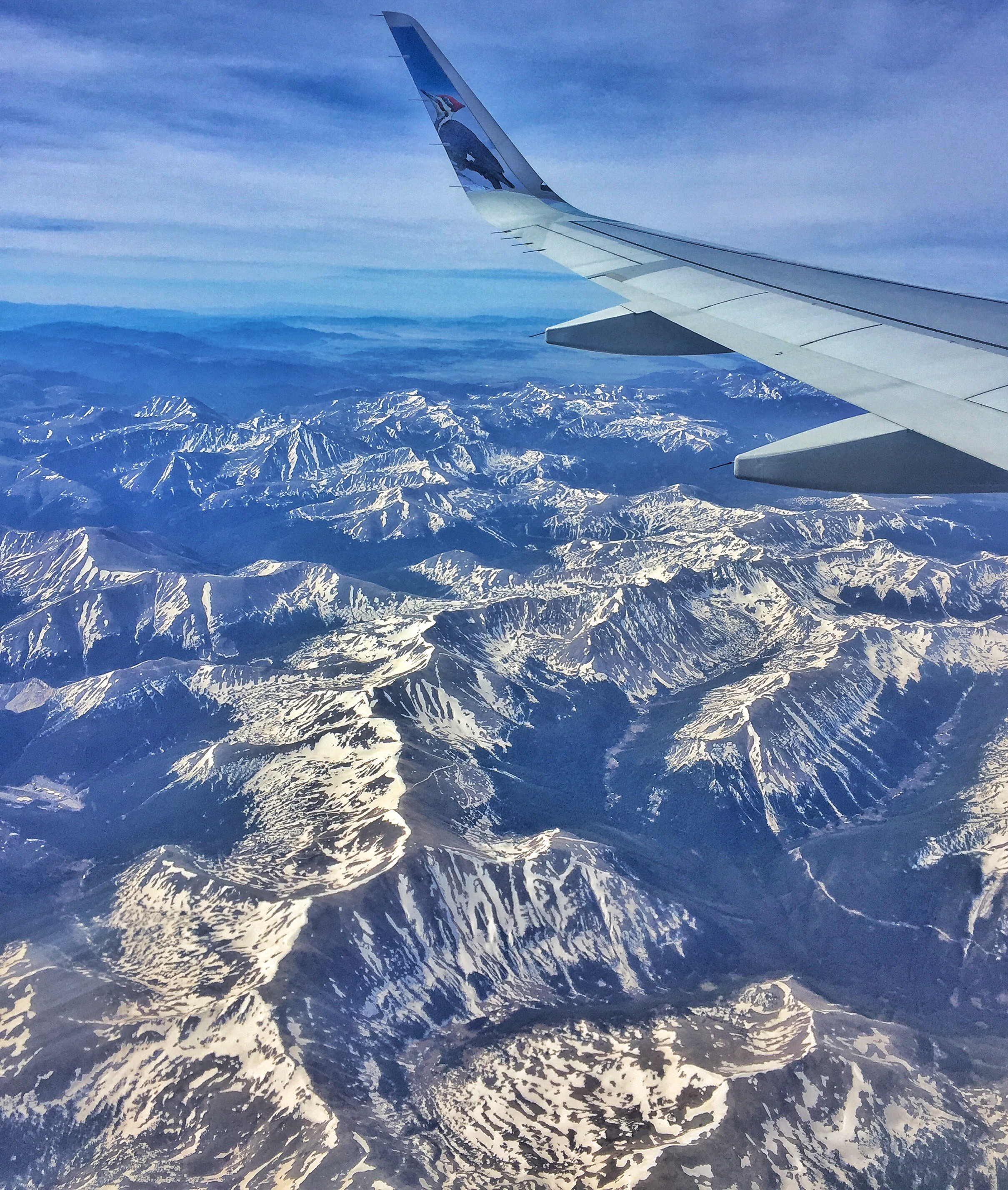 Woman packing a suitcase to save money on Frontier Airlines