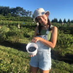 Girl holding bucket