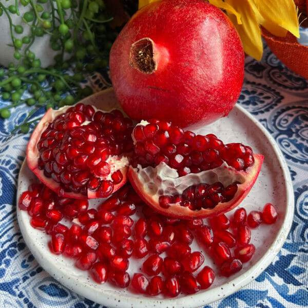 Close-up of pomegranate arils showcasing their vibrant ruby-red color and juicy texture